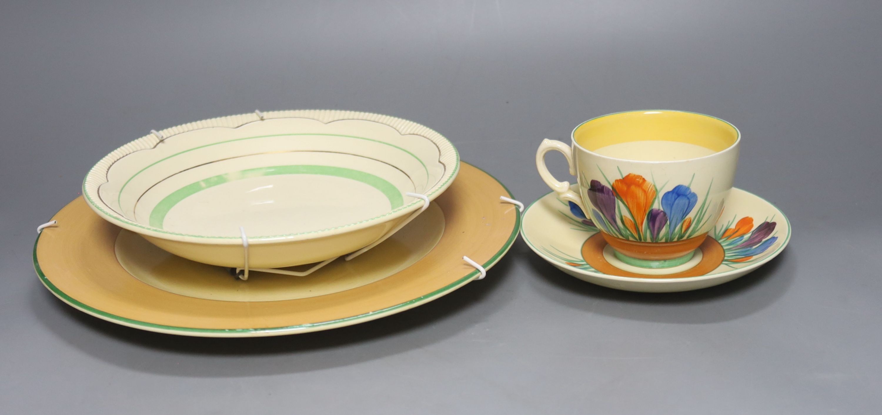 A quantity of Clarice Cliff pottery, Including Crocus pattern tea wares, two preserve jars missing Lids, a plate and three bowls